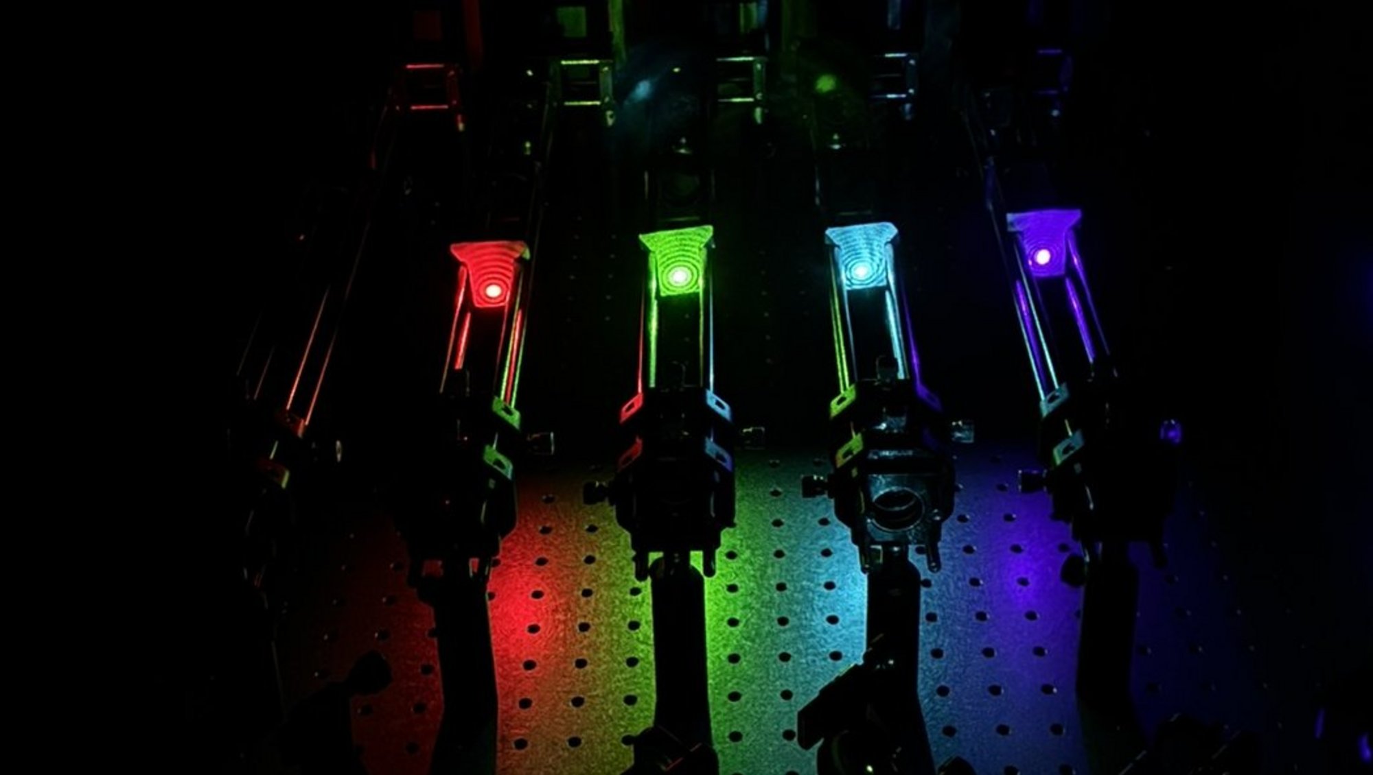 The five laser lines shown from left to right: IR (785 nm), red (637 nm), green (532 nm), blue (488 nm), UV (405 nm)